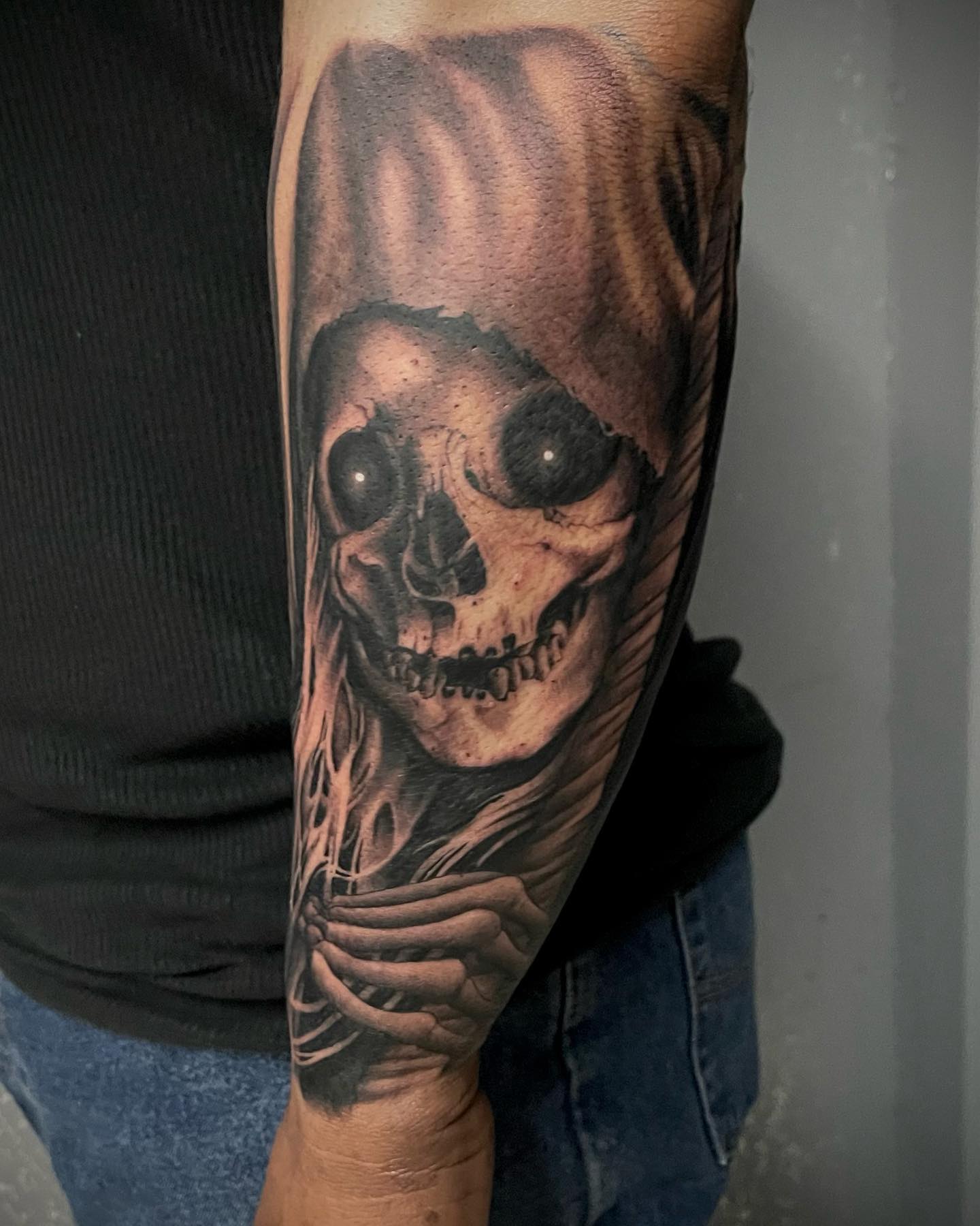 Tatuaje de la Santa Muerte en el brazo.